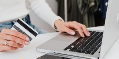 A female is doing business on a laptop