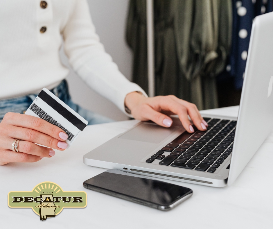 A female is doing business on a laptop