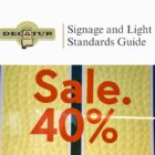 A graphic that states Signage and Light Standards Guide, with a sign that states Sale, 40%.